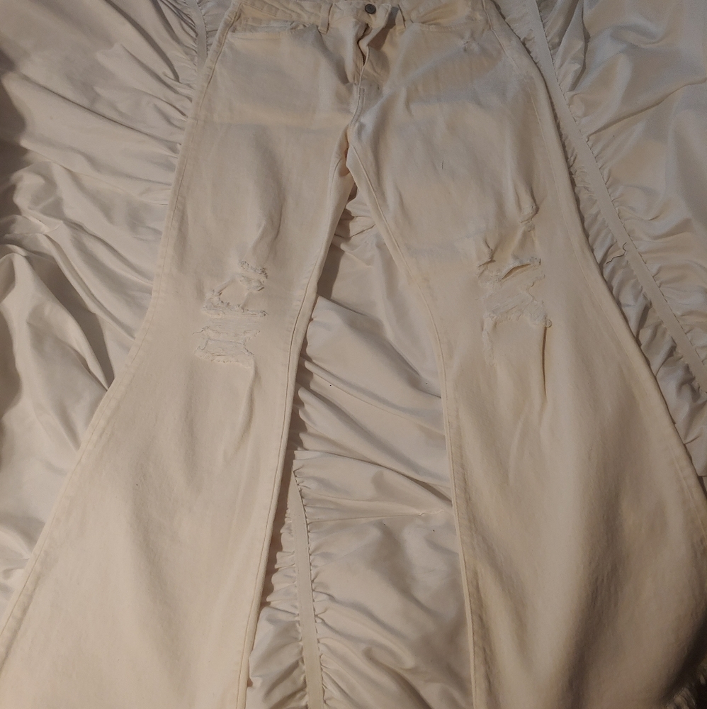 The Buckle Flare out cream colored jeans